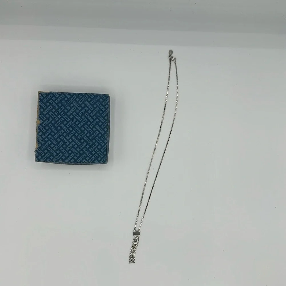 New in box vintage silver tone Avon Lariat fringe necklace